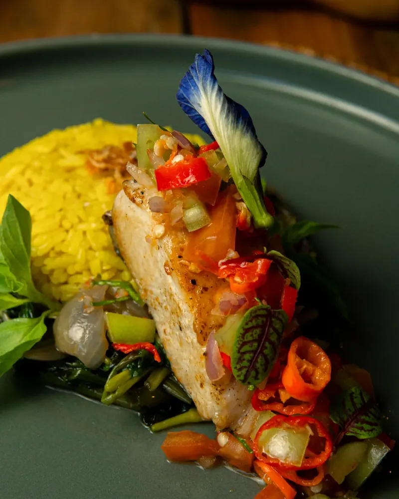 Grilled fish with yellow rice and sambal