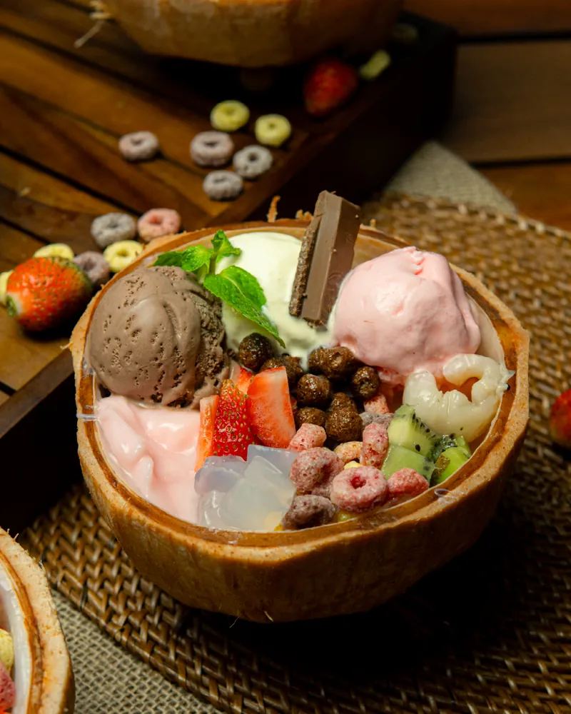 Ice cream served in a coconut bowl