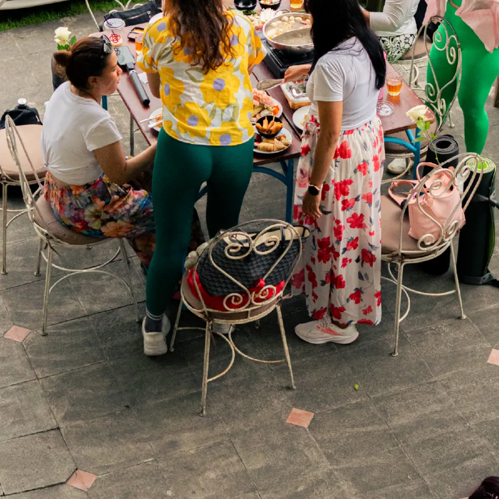 Guests around a table in the courtyard